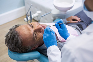 Older man receiving a dental exam