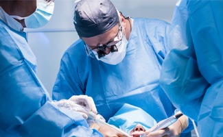 an oral surgeon placing a dental implant