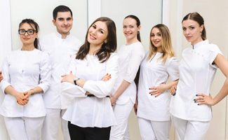 Dental team members smiling together 