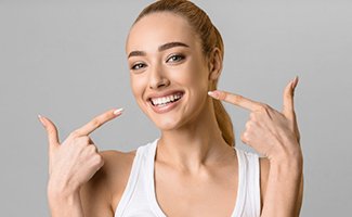 a patient with veneers showing off her smile