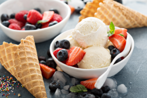 a bowl of vanilla ice cream with berries