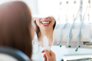 a person admiring their whitened teeth